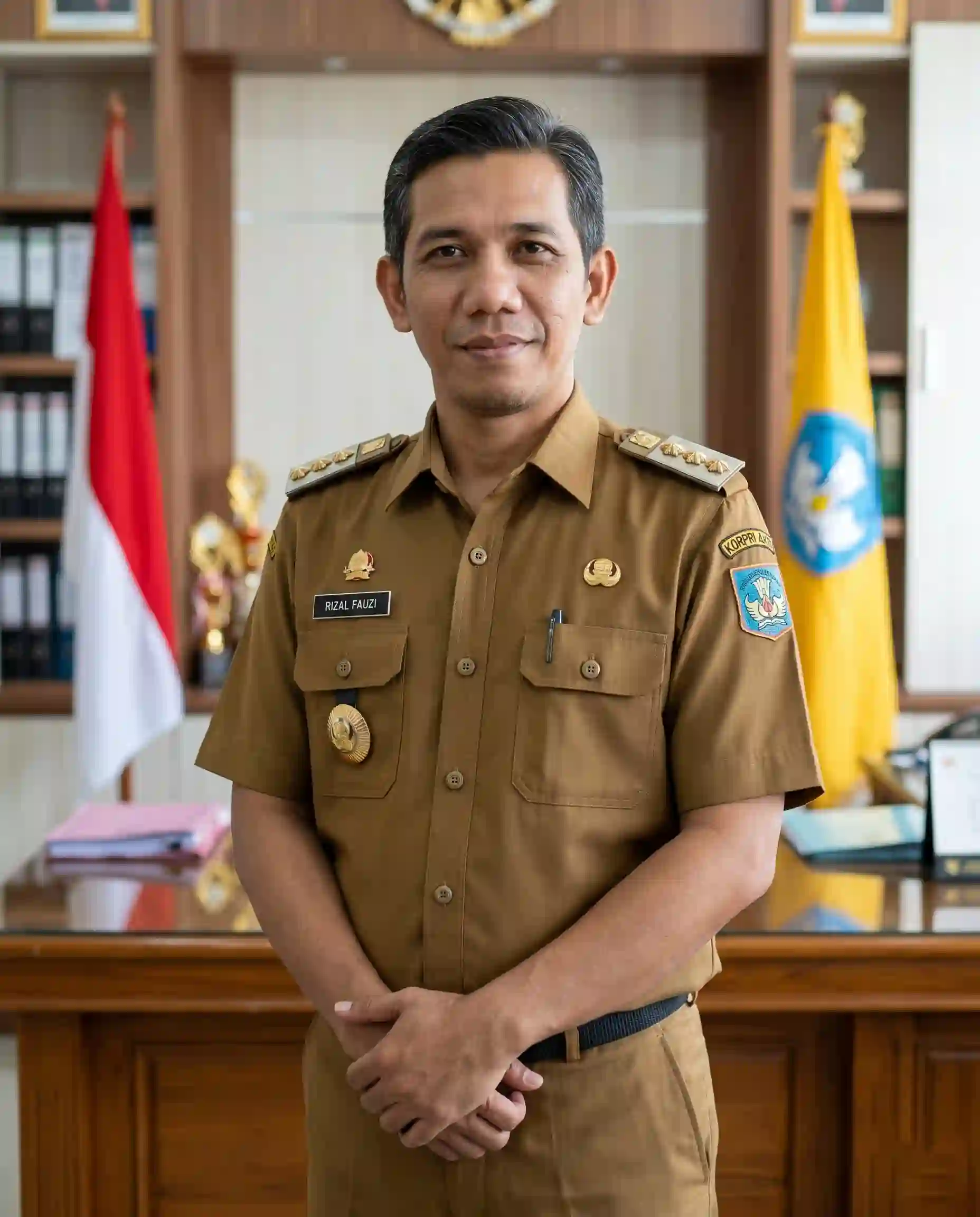 Drs. Rizal Fauzi, M.Pd., A.A.